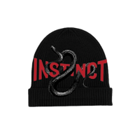 a black beanie with the word instinct on it